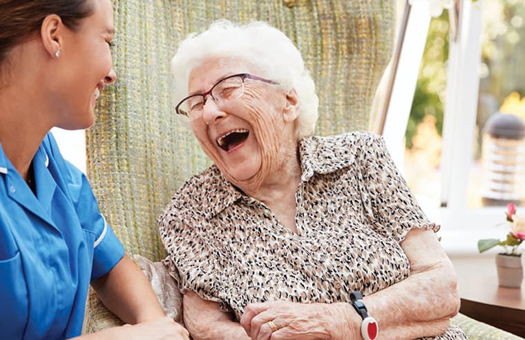 Home is where the heart is - Lady and carer laughing